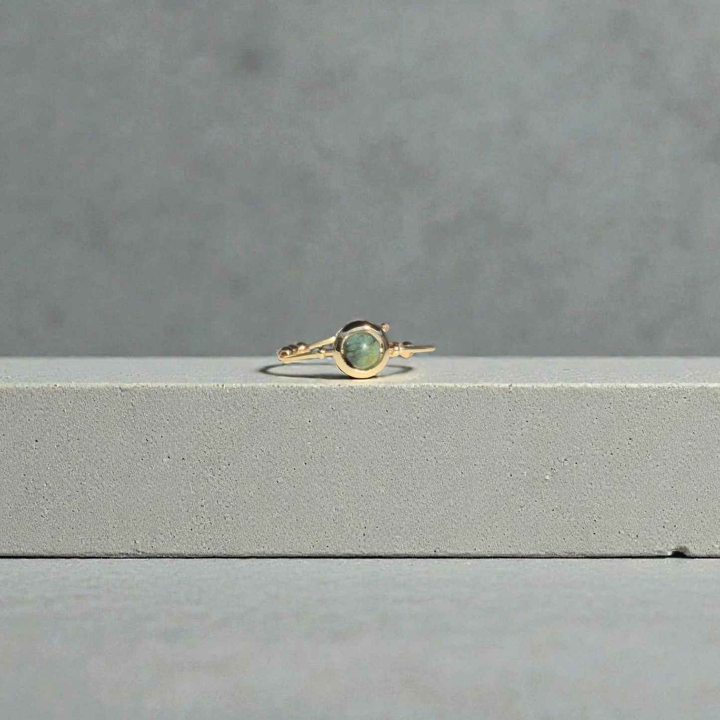 African Turquoise Gemstone Fidget Ring on a gray surface