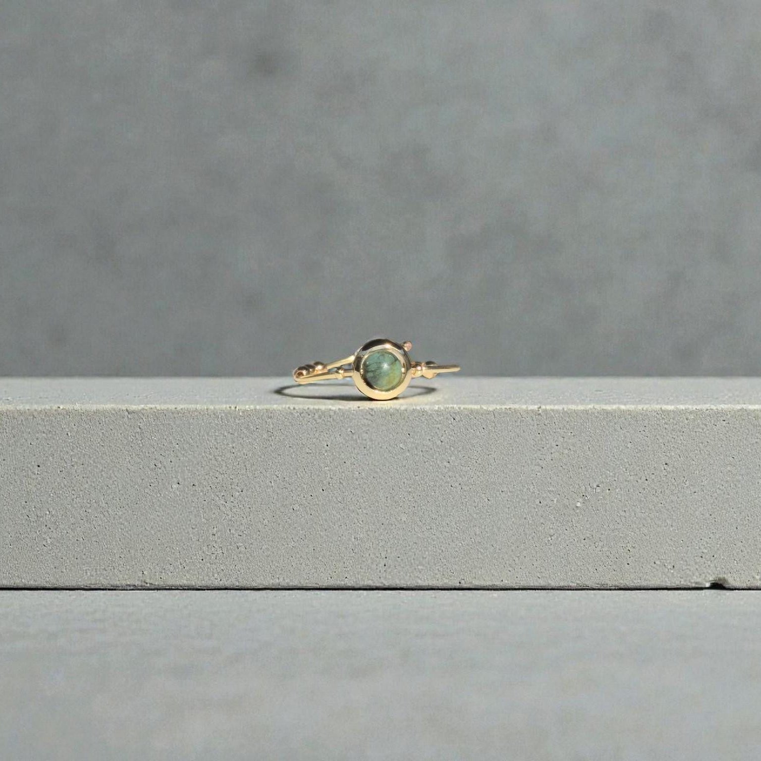 African Turquoise Gemstone Fidget Ring on a gray surface