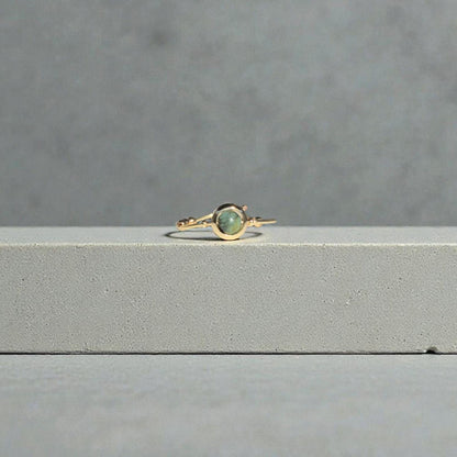 African Turquoise Gemstone Fidget Ring on a gray surface