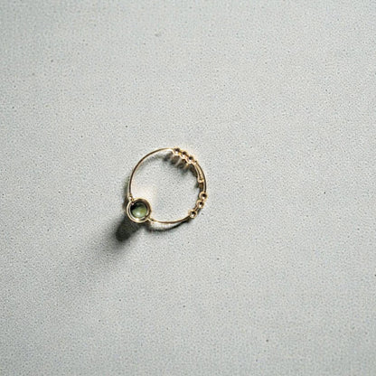 African Turquoise Gemstone Fidget Ring on a gray background