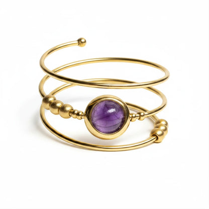 Maison Wednesday gold-plated fidget ring with a spinning amethyst gemstone and accent beads.